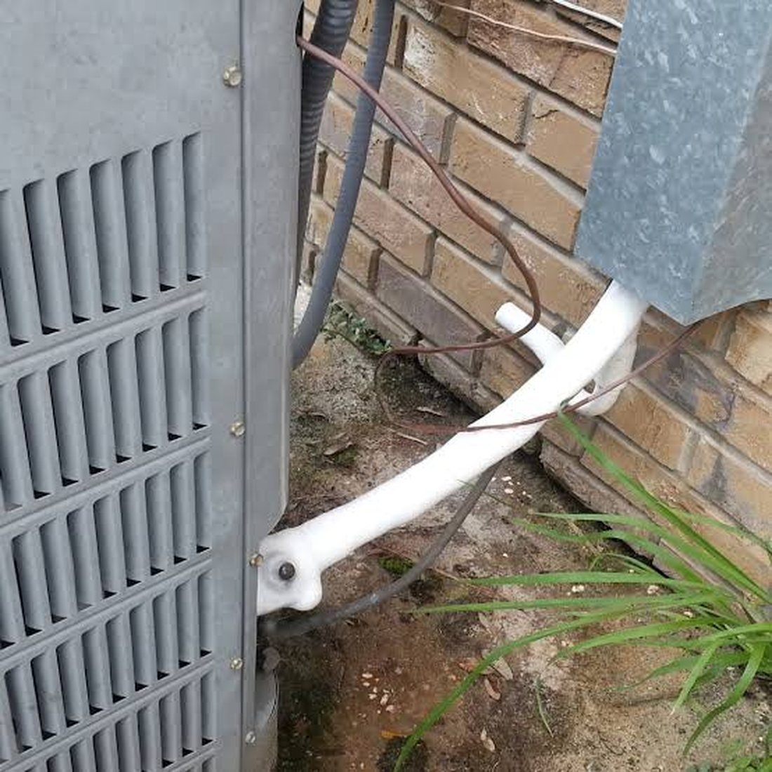 Iced AC line near outdoor condenser during low Freon leak check